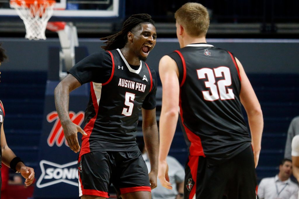 Nov 18, 2025; Oxford, Mississippi, USA; Austin Peay Governors forward Rashaud Marshall (5) reacts with forward Collin Parker (32) after a dunk during the second half against the Mississippi Rebels at The Sandy and John Black Pavilion at Ole Miss. Mandatory Credit: Petre Thomas-Imagn Images