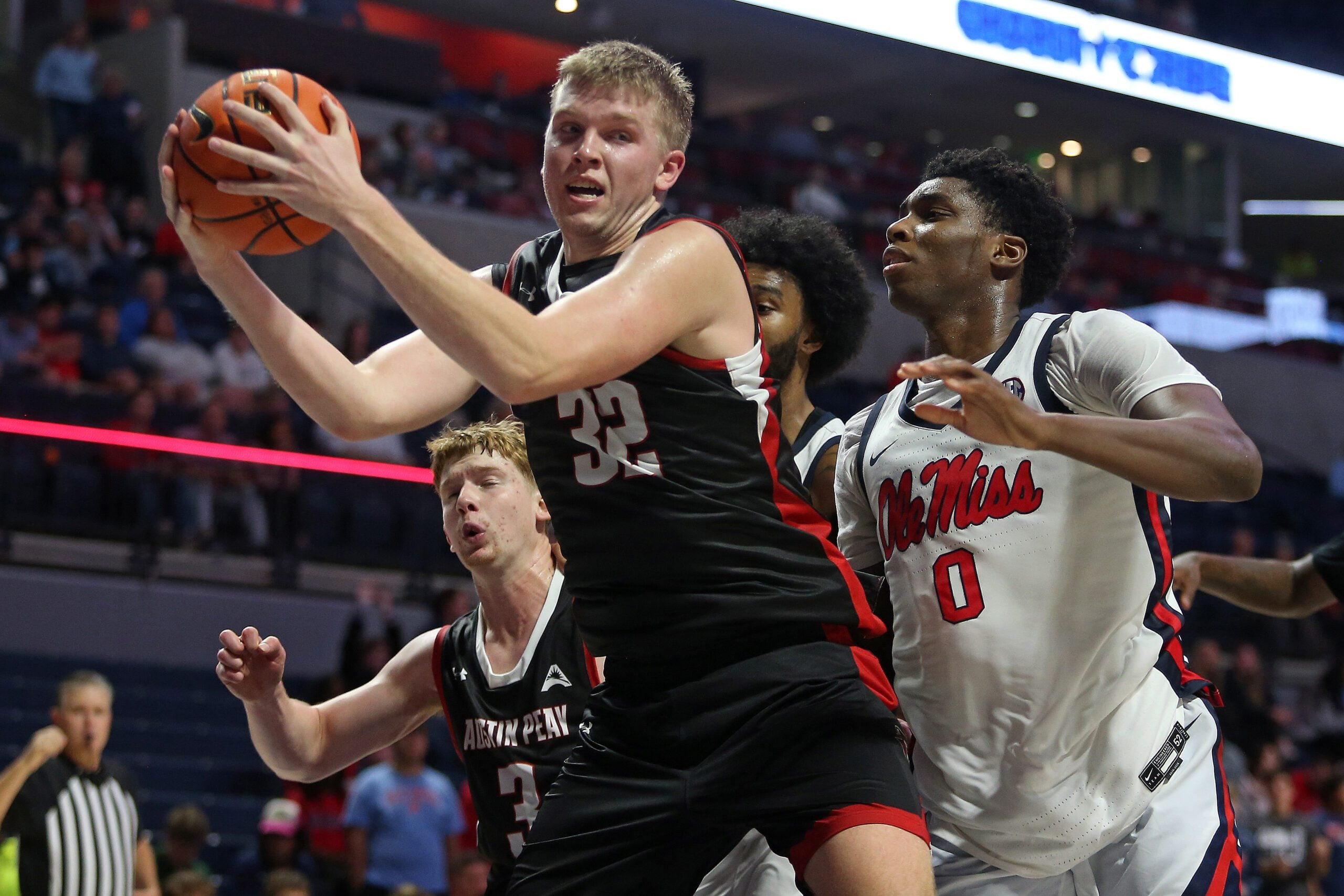 Nov 18, 2025; Oxford, Mississippi, USA; Austin Peay Governors forward Collin Parker (32) collects a rebound during the second half against the Mississippi Rebels at The Sandy and John Black Pavilion at Ole Miss. Mandatory Credit: Petre Thomas-Imagn Images