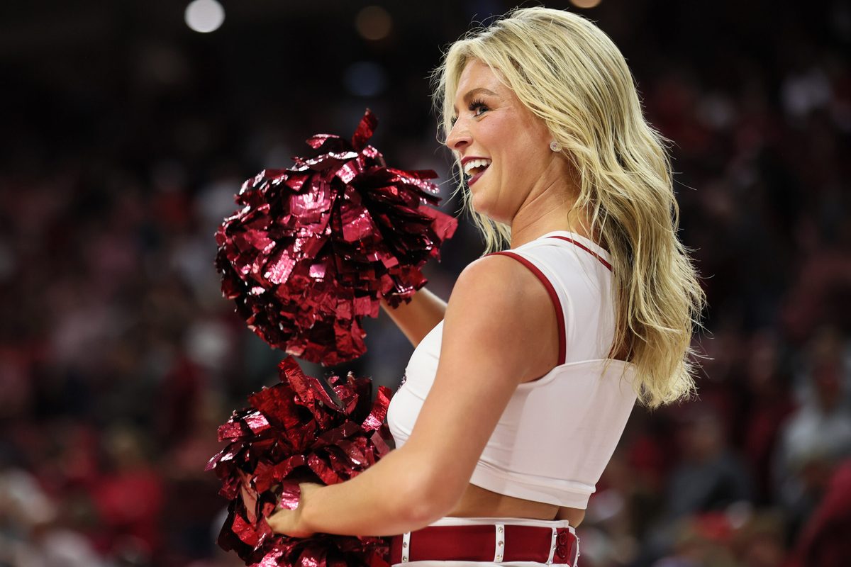 Nov 18, 2025; Fayetteville, Arkansas, USA; Arkansas Razorbacks cheerleader during the second half against the Winthrop Eagles at Bud Walton Arena. Mandatory Credit: Nelson Chenault-Imagn Images
