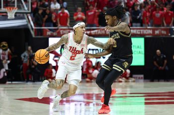 Nov 18, 2025; Salt Lake City, Utah, USA; Utah Utes guard Terrence Brown (2) dribbles against Purdue Fort Wayne Mastodons guard Corey Hadnot II (10) during the second half at Jon M. Huntsman Center. Mandatory Credit: Rob Gray-Imagn Images