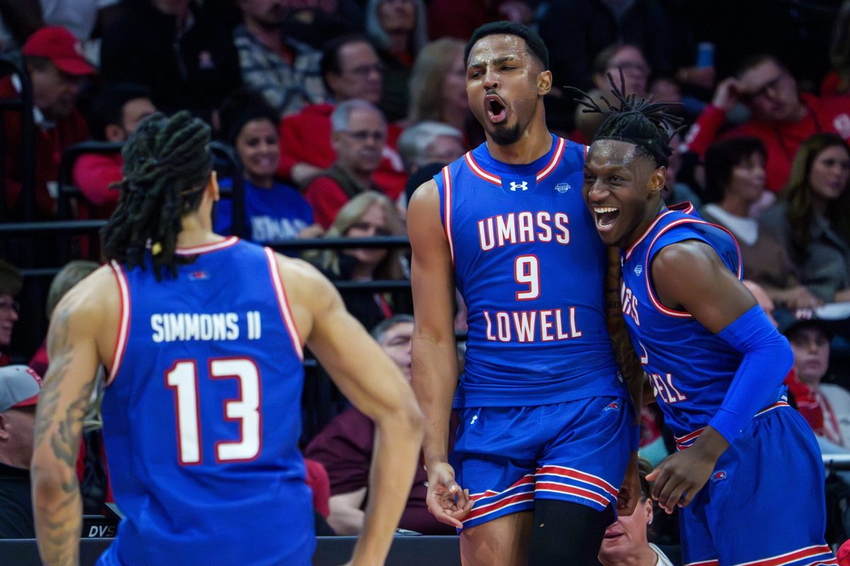 UMass Lowell’s Angel Montas Jr. (9) celebrates his last-second three-pointer against Bradley to end the first half of their college basketball game Wednesday, Nov. 19, 2025 at Carver Arena in Peoria. The Braves rallied to defeat the River Hawks 87-77.