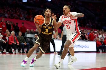 Nov 20, 2025; Columbus, Ohio, USA; Western Michigan Broncos guard Jalen Griffith (2) goes to the basket as Ohio State Buckeyes forward Devin Royal (21) defends during the first half at Value City Arena. Mandatory Credit: Joseph Maiorana-Imagn Images