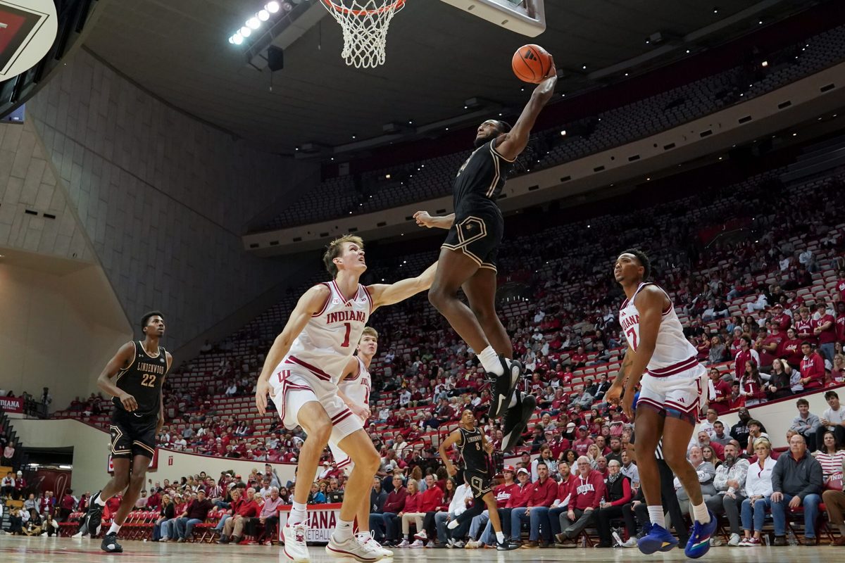 Nov 20, 2025; Bloomington, Indiana, USA; Lindenwood Lions guard Jadis Jones (10) dunks the ball past Indiana Hoosiers forward Reed Bailey (1) during the second half at Simon Skjodt Assembly Hall. Mandatory Credit: Robert Goddin-Imagn Images