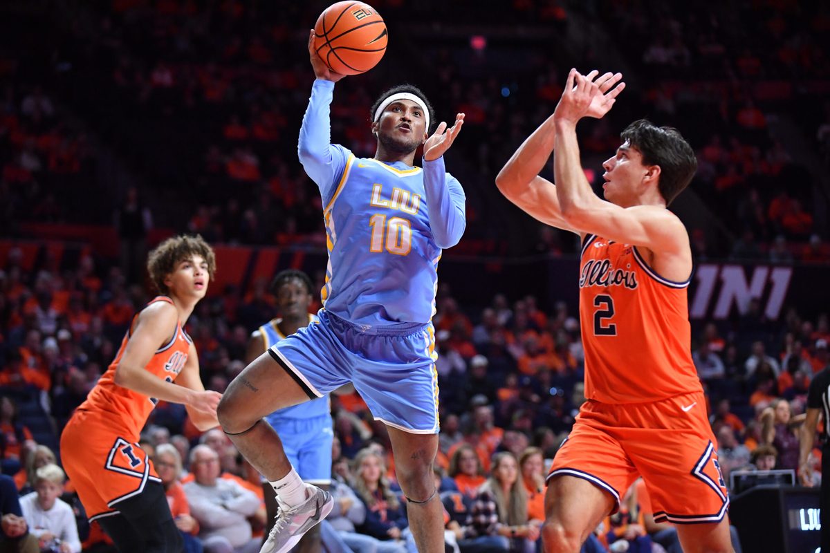 Nov 22, 2025; Champaign, Illinois, USA; Long Island University Sharks guard A.J. Neal, Jr. (10) drives to the basket as Illinois Fighting Illini guard Andrej Stojakovic (2) defends during the second half at State Farm Center. Mandatory Credit: Ron Johnson-Imagn Images