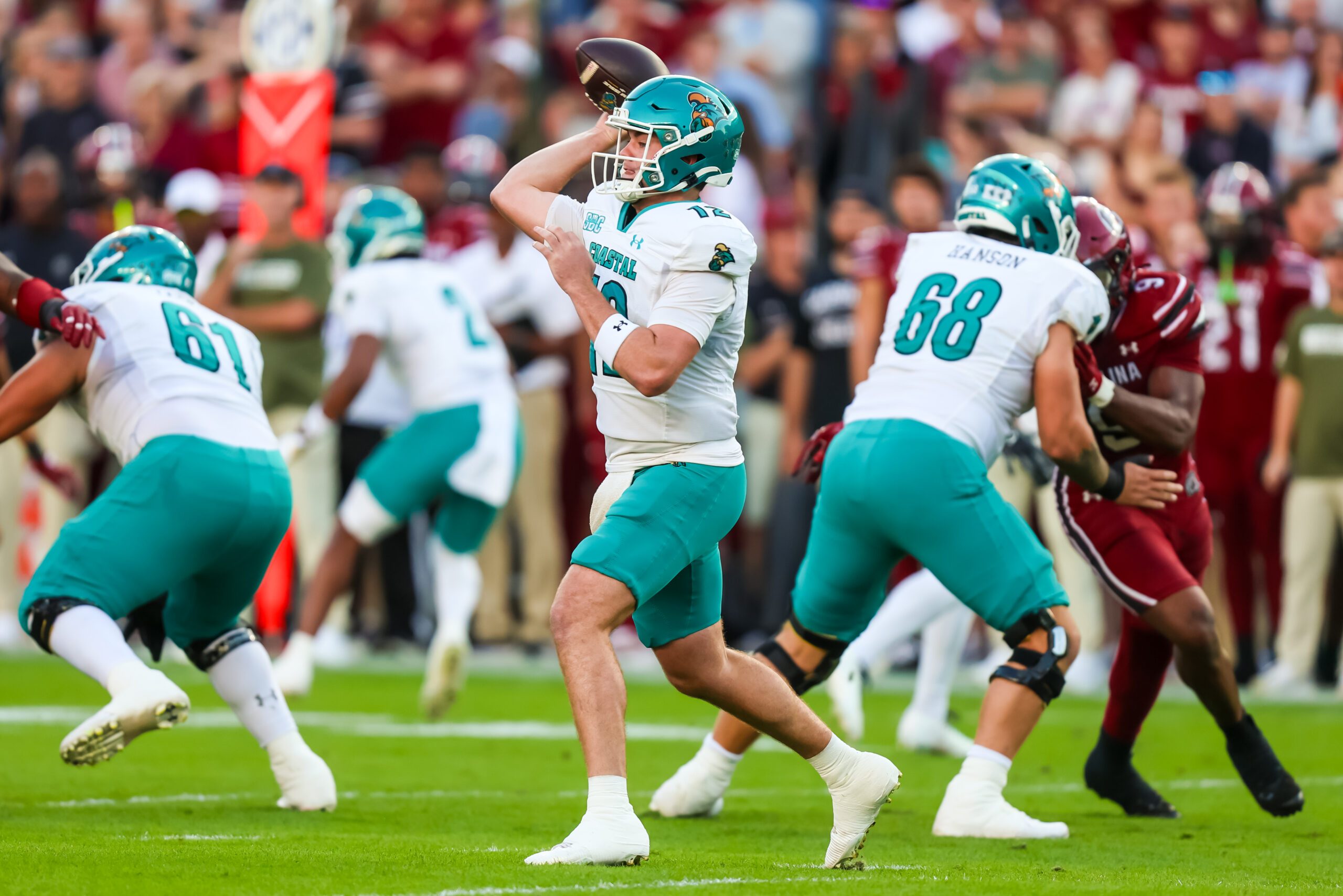 Nov 22, 2025; Columbia, South Carolina, USA; Coastal Carolina Chanticleers quarterback Tad Hudson (12) passes against the South Carolina Gamecocks in the first quarter at Williams-Brice Stadium. Mandatory Credit: Jeff Blake-Imagn Images