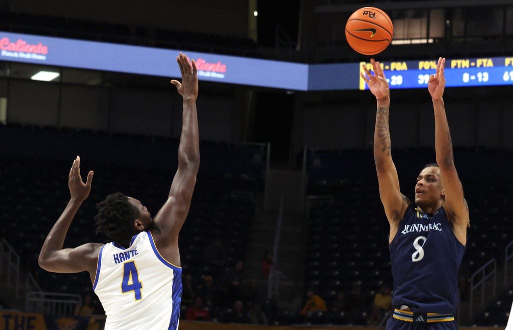 Nov 23, 2025; Pittsburgh, Pennsylvania, USA; Quinnipiac Bobcats forward Grant Randall (8) shoots against Pittsburgh Panthers forward Papa Amadou Kante (4) during the second half at the Petersen Events Center. Mandatory Credit: Charles LeClaire-Imagn Images