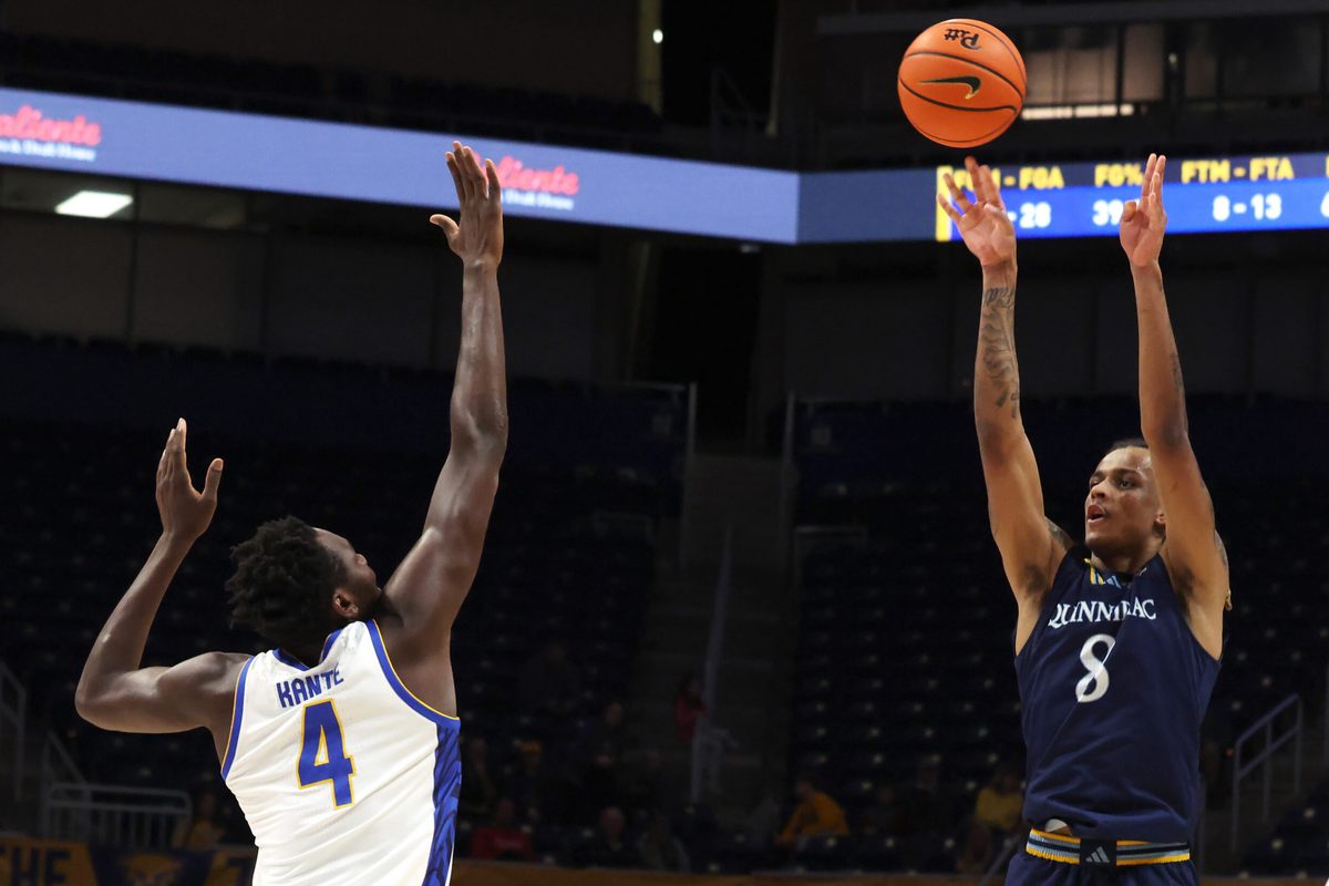 Nov 23, 2025; Pittsburgh, Pennsylvania, USA; Quinnipiac Bobcats forward Grant Randall (8) shoots against Pittsburgh Panthers forward Papa Amadou Kante (4) during the second half at the Petersen Events Center. Mandatory Credit: Charles LeClaire-Imagn Images