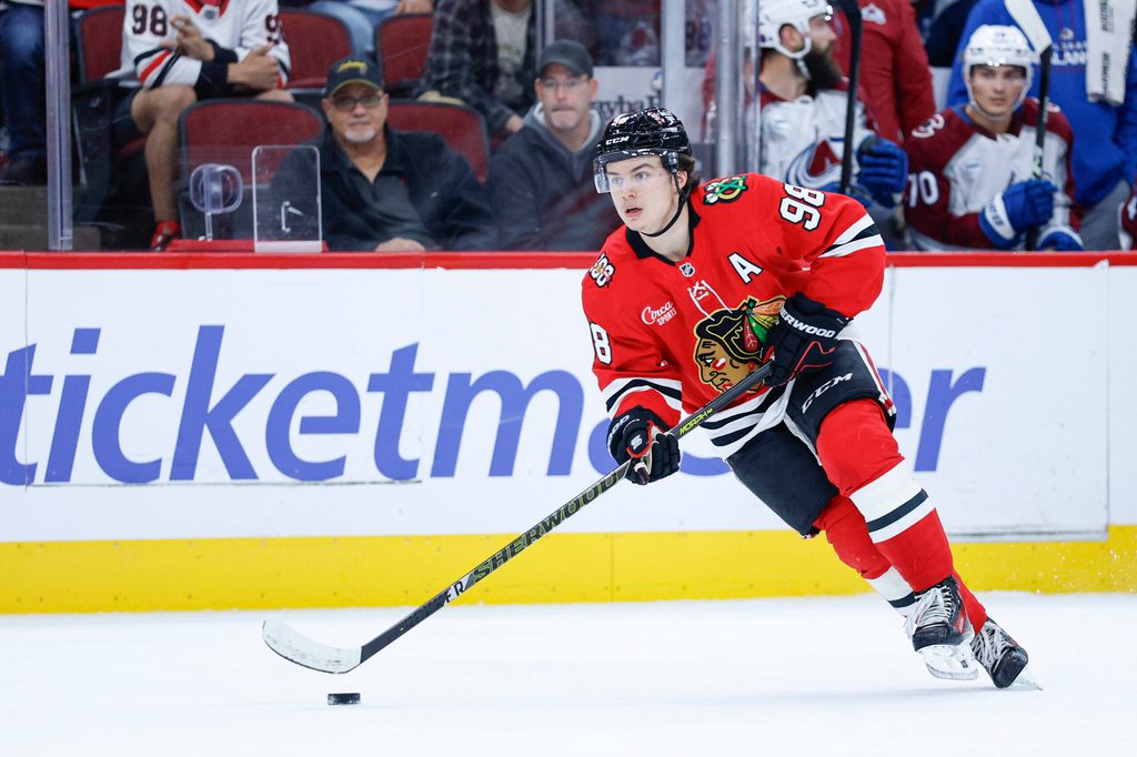 Nov 23, 2025; Chicago, Illinois, USA; Chicago Blackhawks center Connor Bedard (98) looks to pass the puck against the Colorado Avalanche during the first period at United Center. Mandatory Credit: Kamil Krzaczynski-Imagn Images