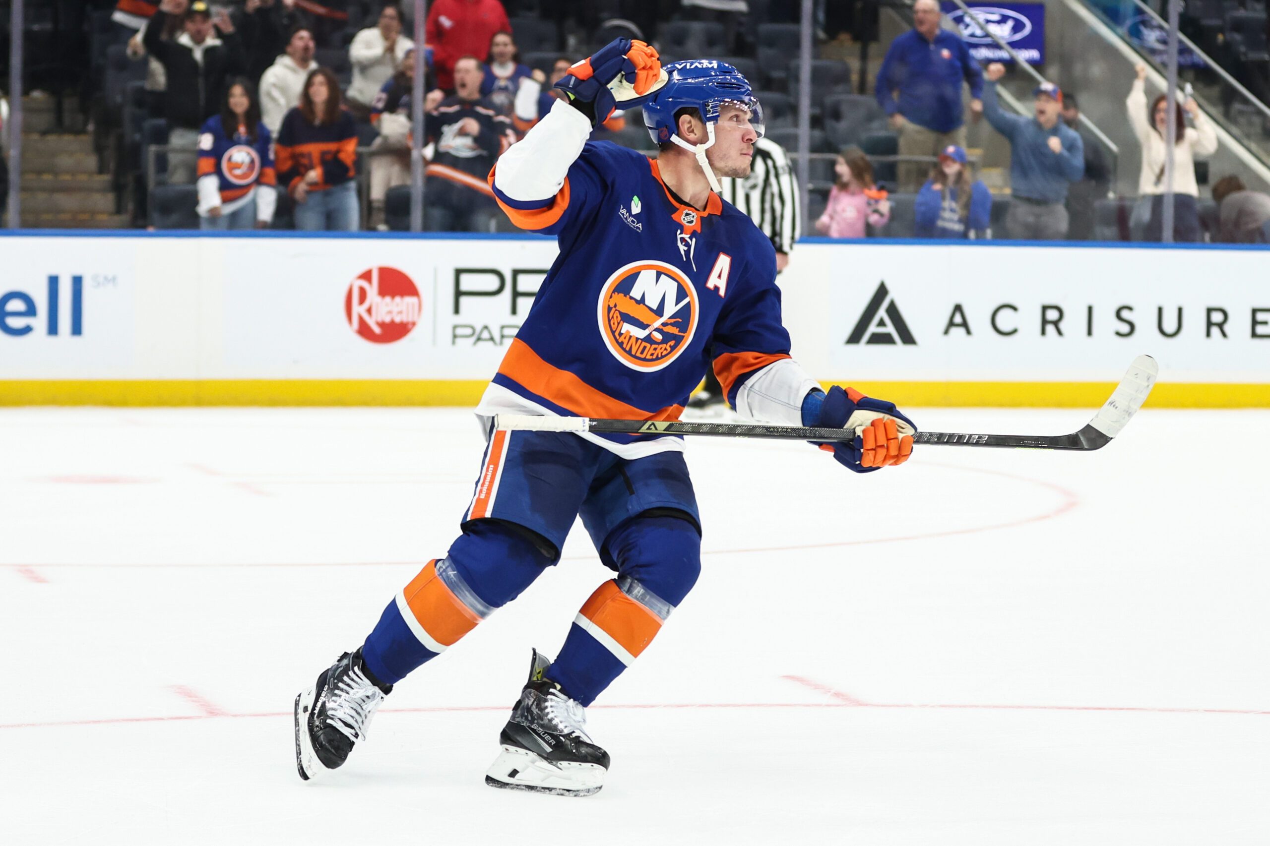 Nov 23, 2025; Elmont, New York, USA;  New York Islanders center Bo Horvat (14) celebrates after scoring a goal during a shootout in overtime against the Seattle Kraken at UBS Arena. Mandatory Credit: Wendell Cruz-Imagn Images