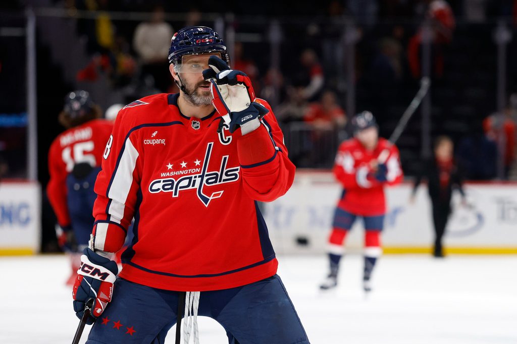 Nov 24, 2025; Washington, District of Columbia, USA; Washington Capitals left wing Alex Ovechkin (8) gestures to his son Sergei (not pictured) after the Capitals' game against the Columbus Blue Jackets at Capital One Arena. Mandatory Credit: Geoff Burke-Imagn Images