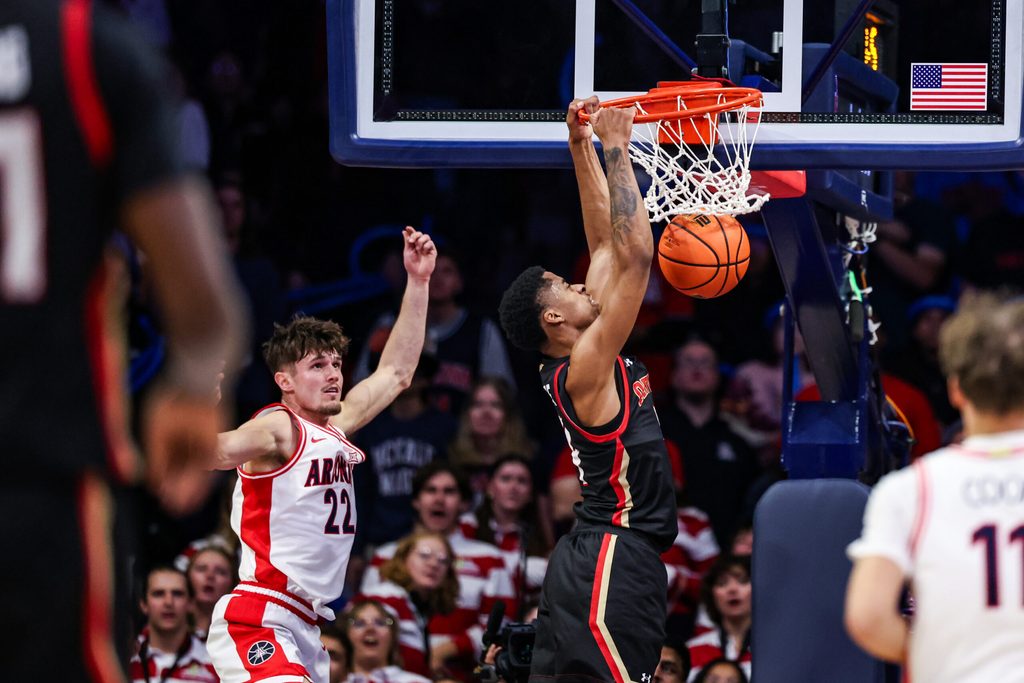Nov 24, 2025; Tucson, Arizona, USA; Denver Pioneers guard Corleone Dandridge (4) dunks the ball during the second half of the game against the Arizona Wildcats at McKale Memorial Center. Mandatory Credit: Aryanna Frank-Imagn Images