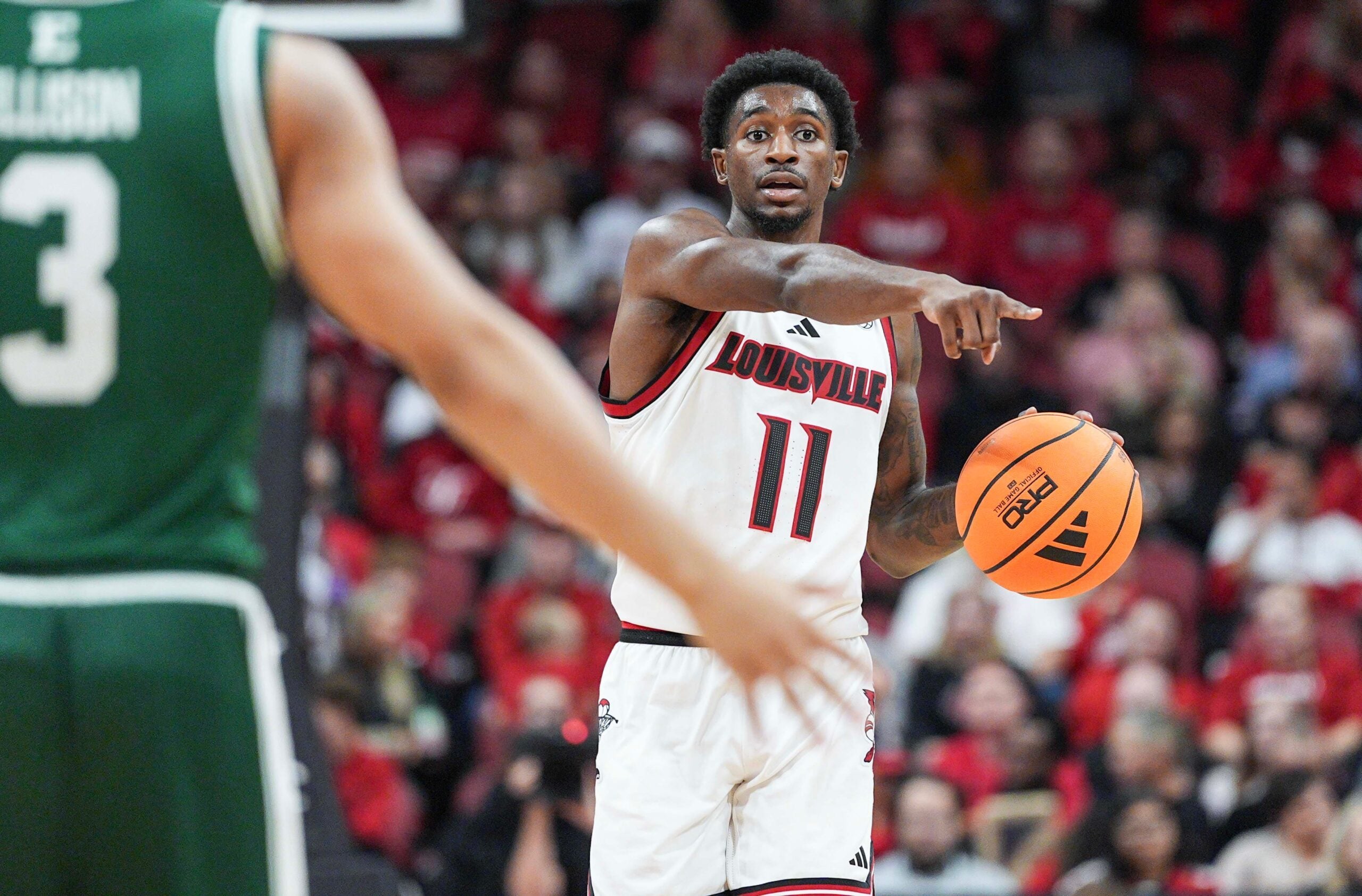 Louisville Cardinals guard Kobe Rodgers (11) brings up the ball as the Cards take on Eastern Michigan Nov. 24, 2025 at the KFC Yum! Center in Louisville, Kentucky.