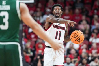 Louisville Cardinals guard Kobe Rodgers (11) brings up the ball as the Cards take on Eastern Michigan Nov. 24, 2025 at the KFC Yum! Center in Louisville, Kentucky.