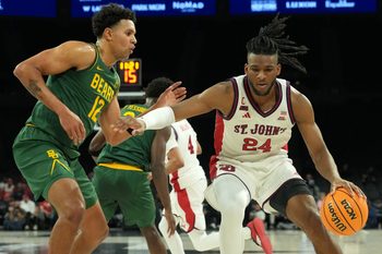 Nov 25, 2025; Las Vegas, Nevada, USA; St. John's Red Storm forward Zuby Ejiofor (24) dribbles the ball against Baylor Bears guard Michael Rataj (12) in a 2025 Players Era Festival group play game at Michelob Ultra Arena. Mandatory Credit: Kirby Lee-Imagn Images