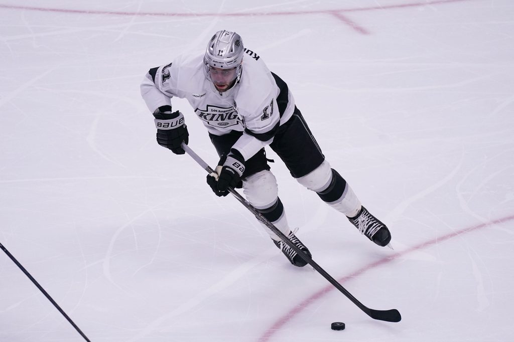 Nov 20, 2025; San Jose, California, USA; Los Angeles Kings center Anze Kopitar (11) controls the puck in the third period against the San Jose Sharks at SAP Center in San Jose. Mandatory Credit: David Gonzales-Imagn Images