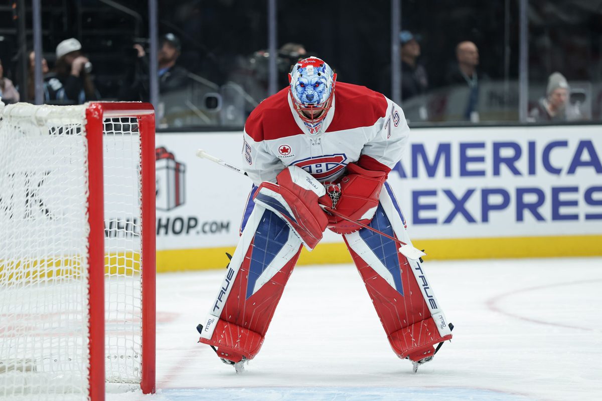 Nov 26, 2025; Salt Lake City, Utah, USA; Montreal Canadiens goaltender Jakub Dobes (75) stretches during a stop in play against the Utah Mammoth during the first period at Delta Center. Mandatory Credit: Chris Nicoll-Imagn Images