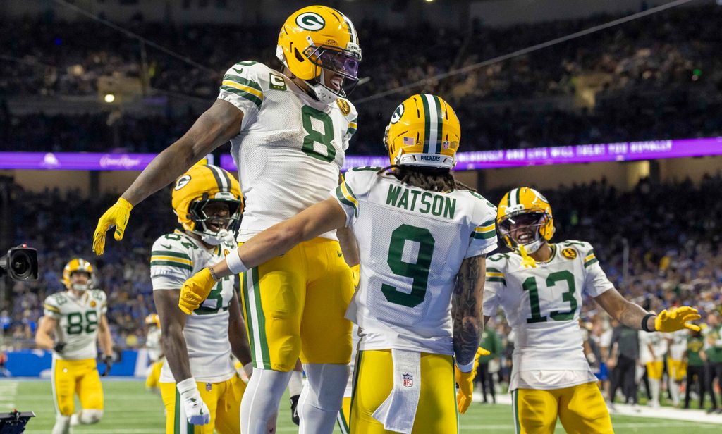 Nov 27, 2025; Detroit, Michigan, USA; Green Bay Packers running back Josh Jacobs (8) and Green Bay Packers wide receiver Christian Watson (9) celebrate after a touchdown against the Detroit Lions during the third quarter at Ford Field. Mandatory Credit: David Reginek-Imagn Images