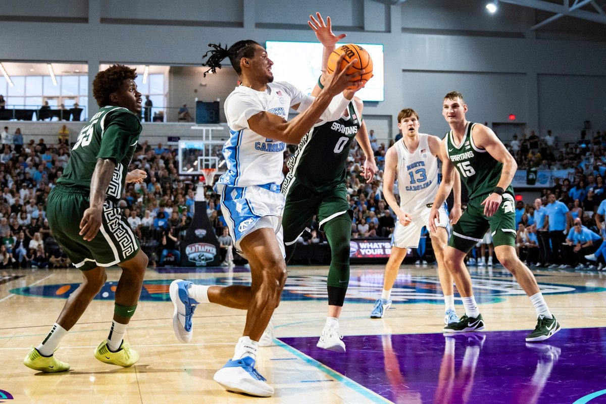North Carolina Tar Heels forward Jarin Stevenson (15) drives to the basket as Michigan State Spartans forward Jaxon Kohler (0) guards him during the first half of the Fort Myers Tip-Off Beach Division game at Suncoast Credit Union Arena on Fort Myers, Fla., on Thursday, Nov. 27, 2025.