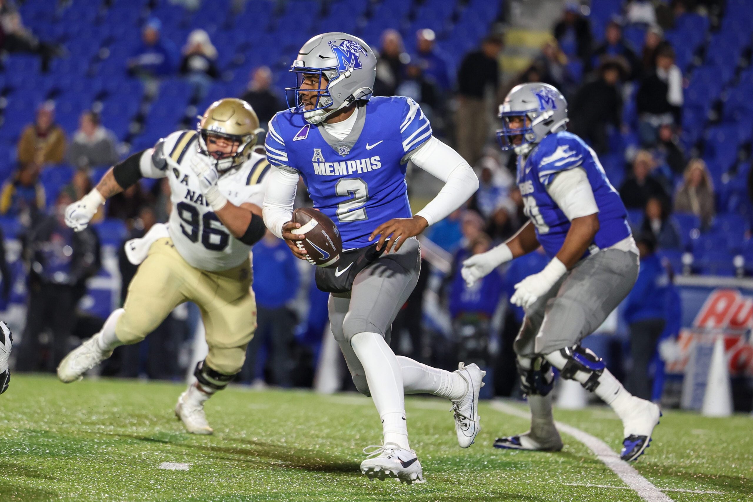 Nov 27, 2025; Memphis, Tennessee, USA; Memphis Tigers quarterback Brendon Lewis (2) runs with the ball against the Navy Midshipmen during the second half at Simmons Bank Liberty Stadium. Mandatory Credit: Wesley Hale-Imagn Images