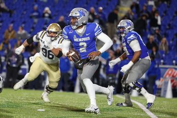 Nov 27, 2025; Memphis, Tennessee, USA; Memphis Tigers quarterback Brendon Lewis (2) runs with the ball against the Navy Midshipmen during the second half at Simmons Bank Liberty Stadium. Mandatory Credit: Wesley Hale-Imagn Images