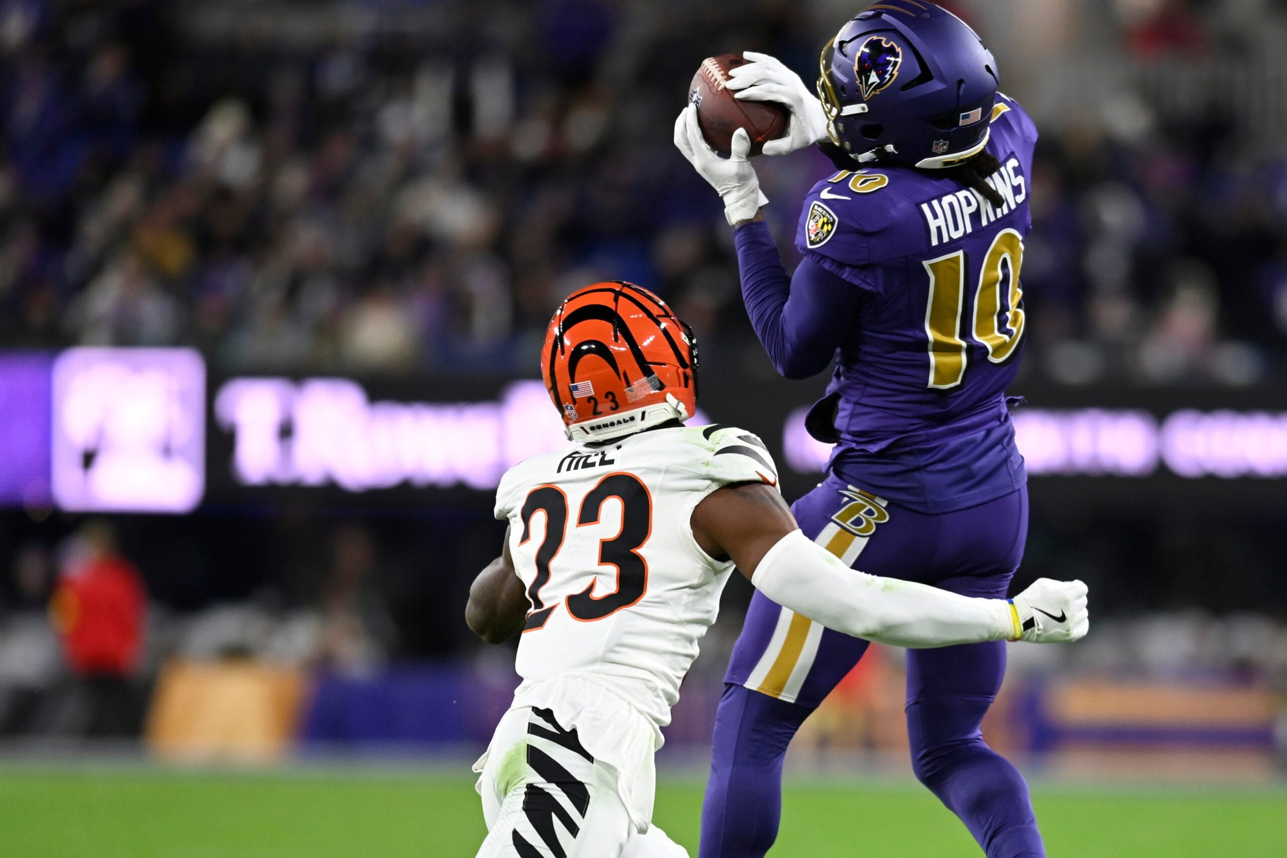Nov 27, 2025; Baltimore, Maryland, USA; Baltimore Ravens wide receiver DeAndre Hopkins (10) makes a catch against Cincinnati Bengals cornerback Dax Hill (23) during the second half at M&T Bank Stadium. Mandatory Credit: Tommy Gilligan-Imagn Images