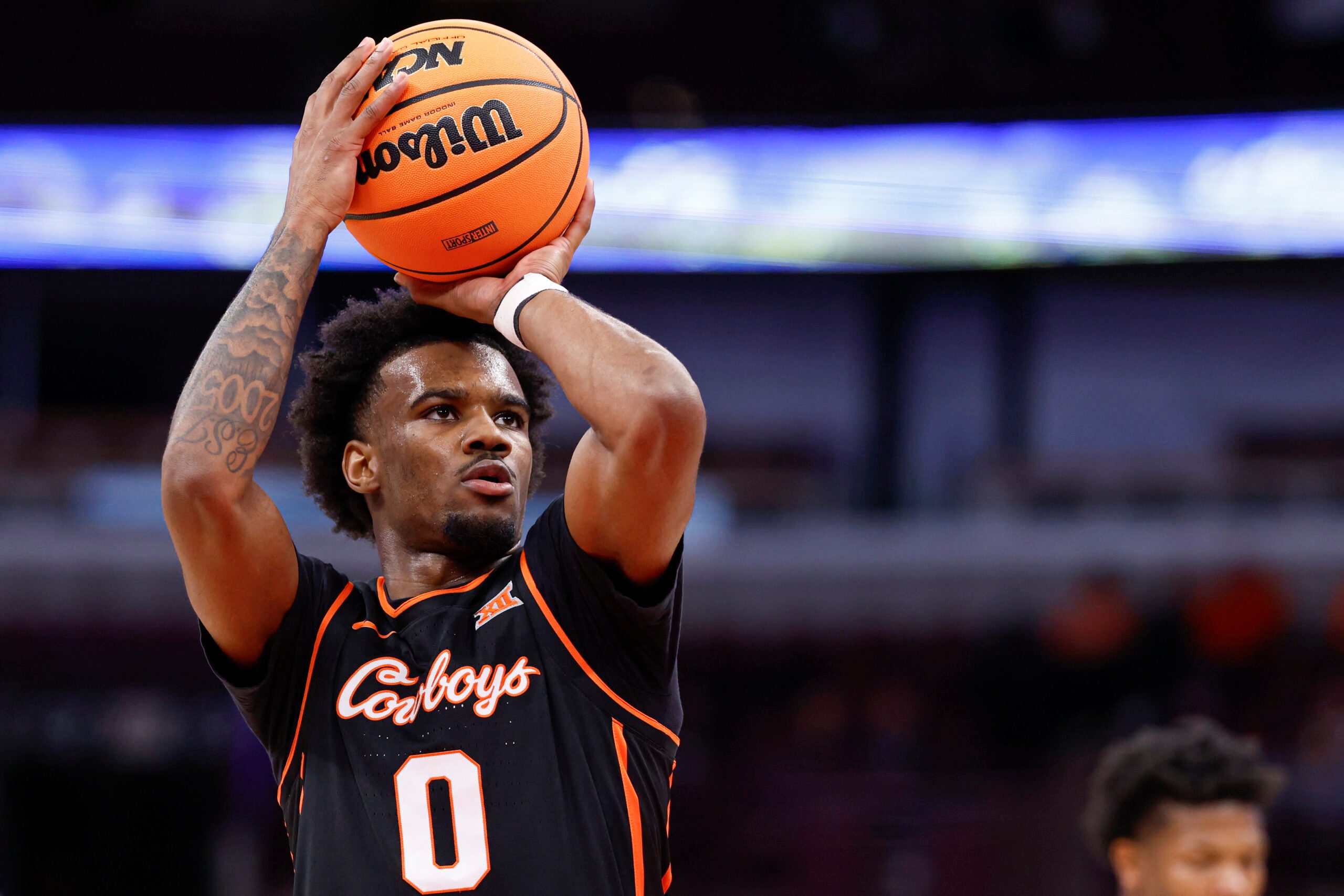 Nov 27, 2025; Chicago, Illinois, USA; Oklahoma State Cowboys guard Jaylen Curry (0) shoots a free throw against Northwestern Wildcats during the first half at United Center. Mandatory Credit: Kamil Krzaczynski-Imagn Images