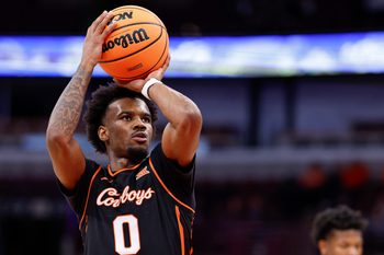 Nov 27, 2025; Chicago, Illinois, USA; Oklahoma State Cowboys guard Jaylen Curry (0) shoots a free throw against Northwestern Wildcats during the first half at United Center. Mandatory Credit: Kamil Krzaczynski-Imagn Images