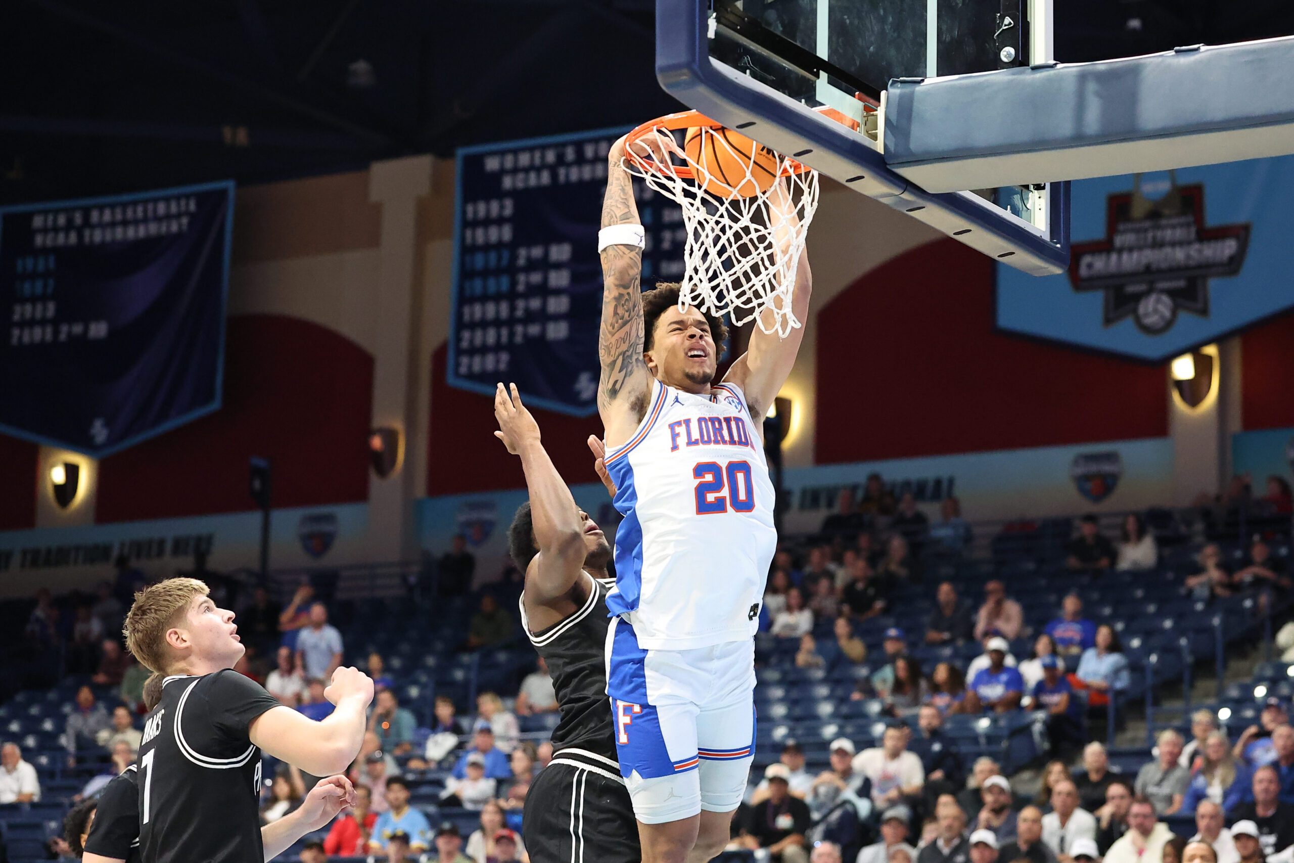 Nov 28, 2025; San Diego, CA, USA; Florida Gators guard Isaiah Brown (20) dunks the ball against the Providence Friars during the first half at Jenny Craig Pavilion. Mandatory Credit: Abe Arredondo-Imagn Images