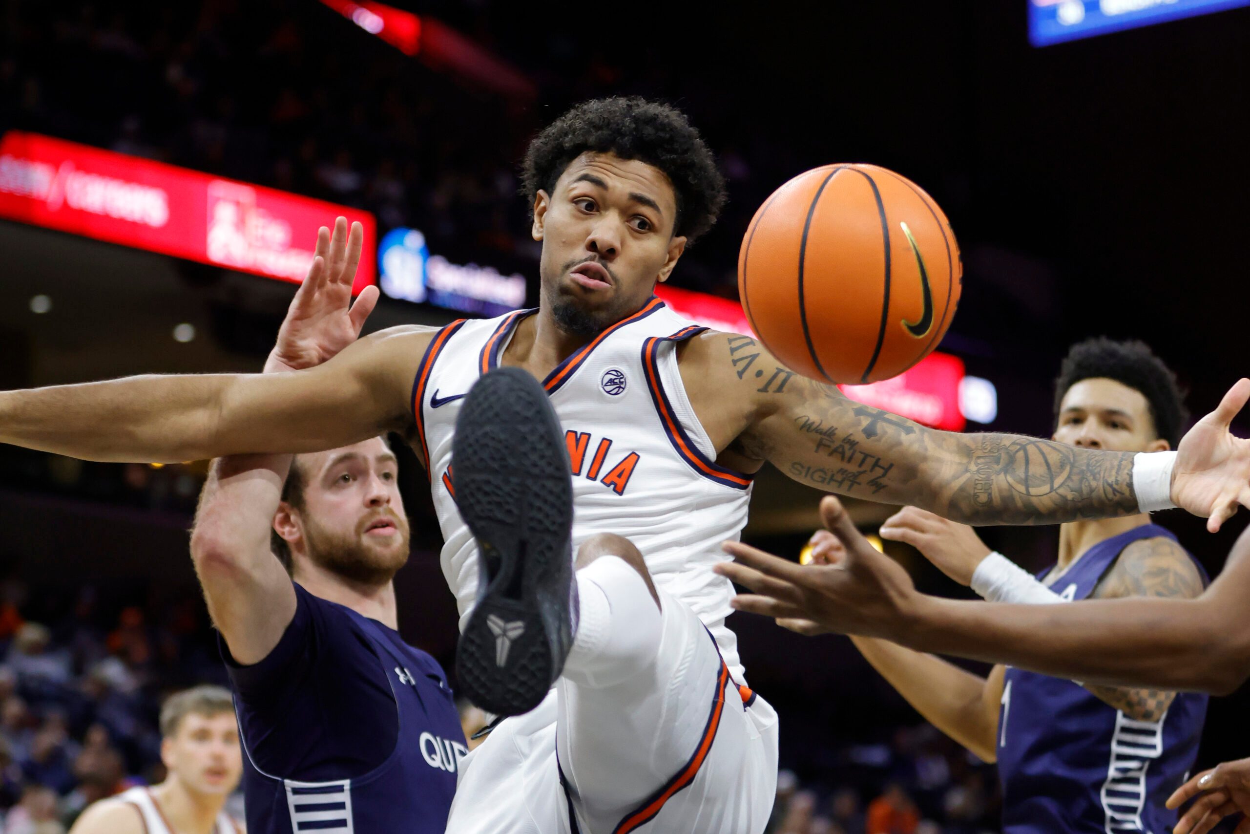 Nov 28, 2025; Charlottesville, Virginia, USA; Virginia Cavaliers guard Malik Thomas (1) battles for the ball against the Queens University of Charlotte Royals during the second half at John Paul Jones Arena. Mandatory Credit: Amber Searls-Imagn Images
