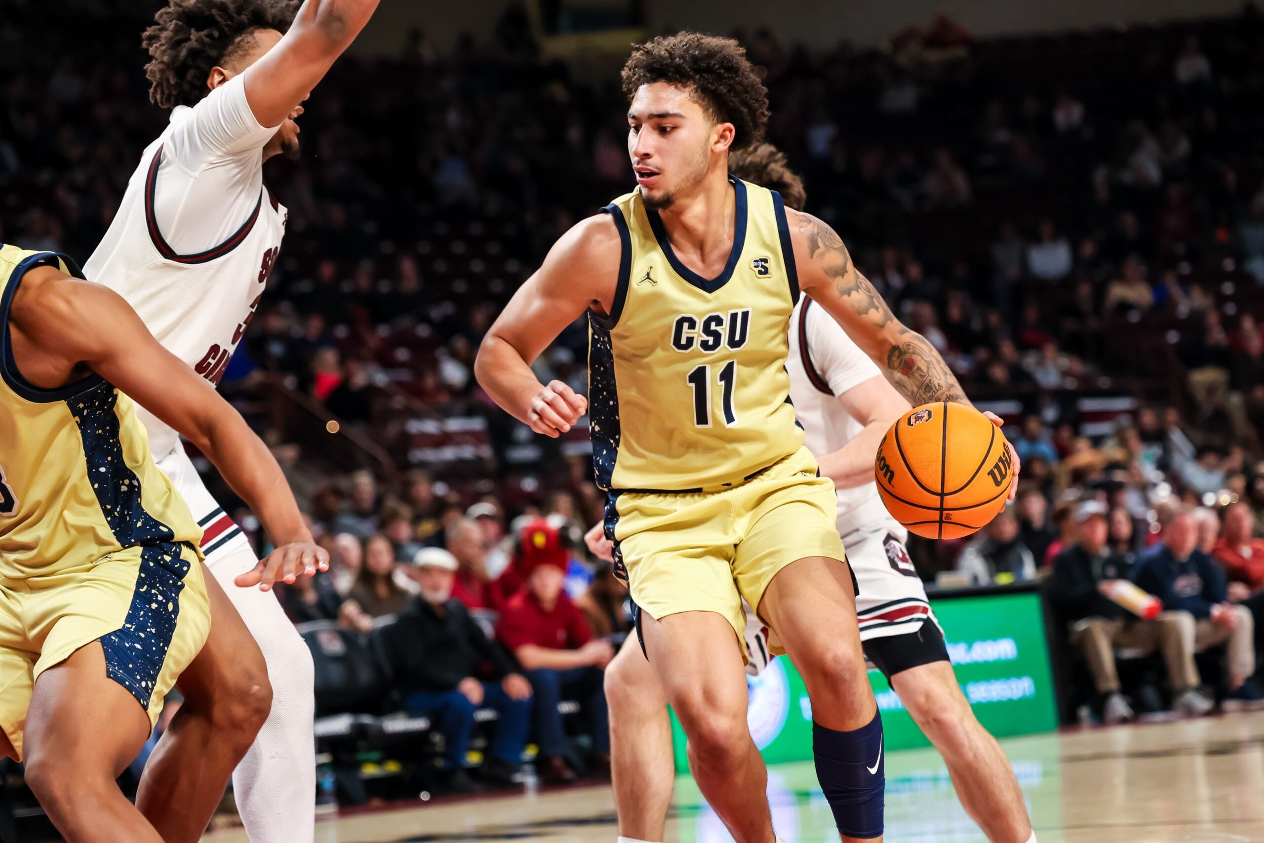 Nov 28, 2025; Columbia, South Carolina, USA; Charleston Southern Buccaneers guard Brycen Blaine (11) drives against the South Carolina Gamecocks in the second half at Colonial Life Arena. Mandatory Credit: Jeff Blake-Imagn Images