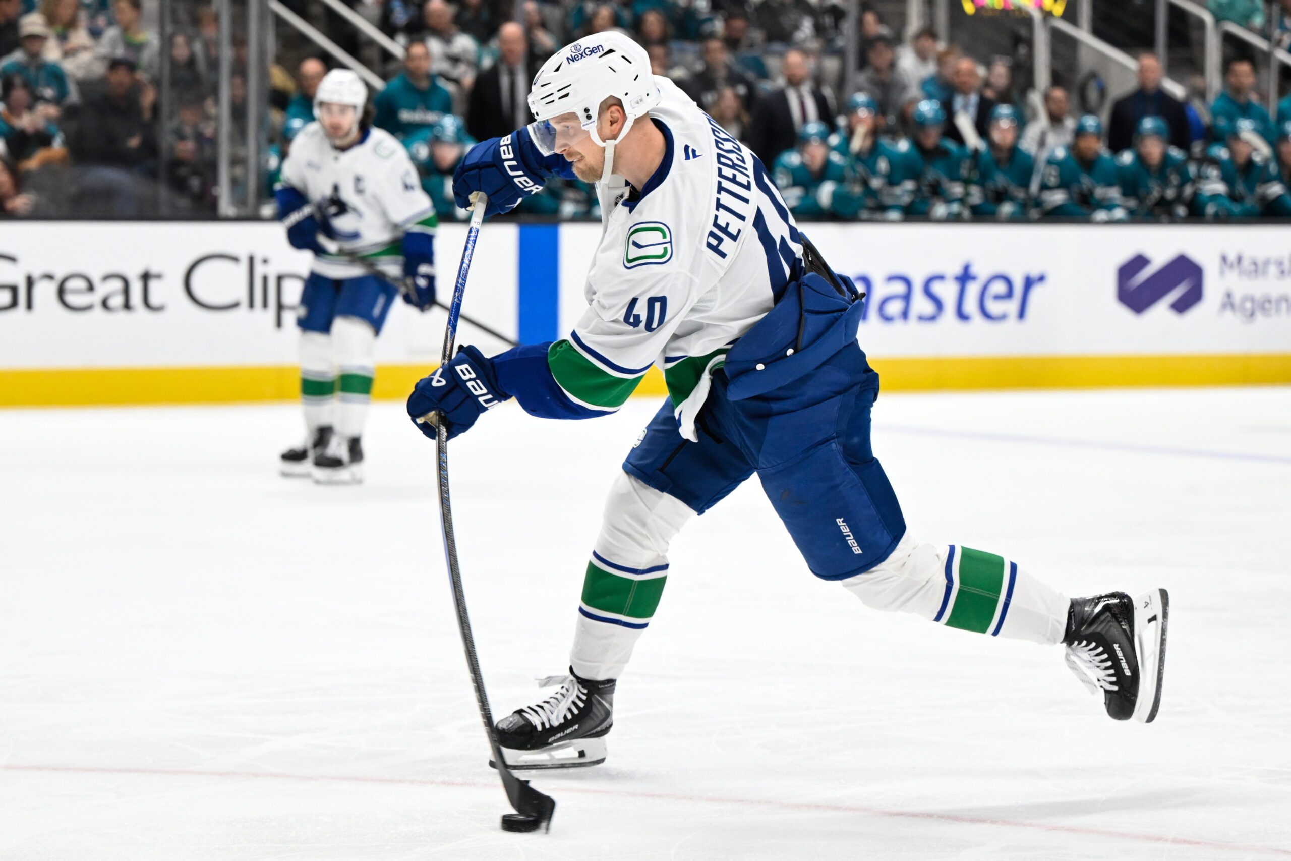 Nov 28, 2025; San Jose, California, USA; Vancouver Canucks center Elias Pettersson (40) takes a shot on goal against the San Jose Sharks in the third period at SAP Center at San Jose. Mandatory Credit: Eakin Howard-Imagn Images