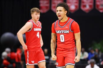 Nov 28, 2025; Kissimmee, FL, USA; Dayton Flyers guard Javon Bennett (0) reacts after a basket against the Brigham Young University Cougars in the first half during the ESPN Events Invitational at State Farm Field House. Mandatory Credit: Nathan Ray Seebeck-Imagn Images