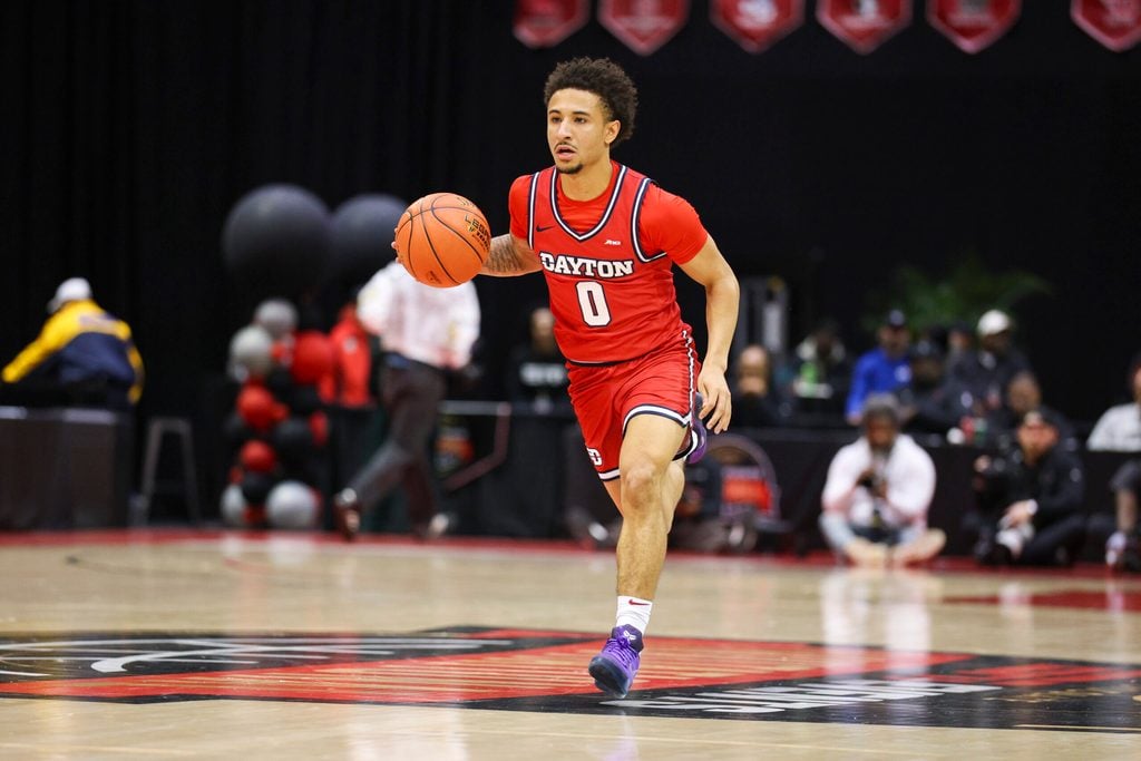 Nov 28, 2025; Kissimmee, FL, USA; =Dayton Flyers guard Javon Bennett (0) controls the ball against the Brigham Young University Cougars in the first half during the ESPN Events Invitational at State Farm Field House. Mandatory Credit: Nathan Ray Seebeck-Imagn Images