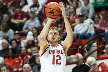 Nov 29, 2025; Bloomington, Indiana, USA; Indiana Hoosiers forward Tucker Devries (12) shoots the ball during the first half against the Bethune-Cookman Wildcats at Simon Skjodt Assembly Hall. Mandatory Credit: Robert Goddin-Imagn Images