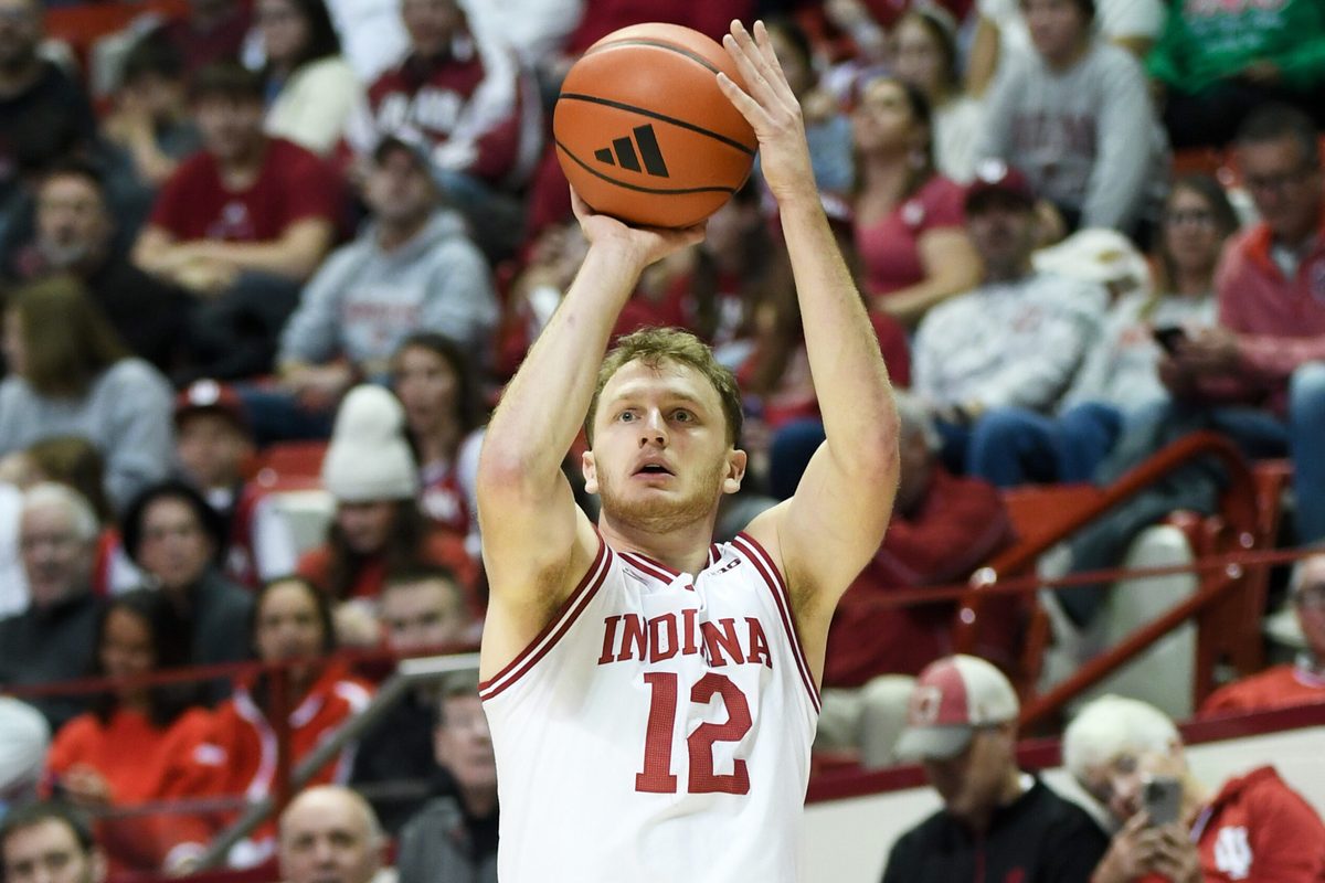 Nov 29, 2025; Bloomington, Indiana, USA; Indiana Hoosiers forward Tucker Devries (12) shoots the ball during the first half against the Bethune-Cookman Wildcats at Simon Skjodt Assembly Hall. Mandatory Credit: Robert Goddin-Imagn Images