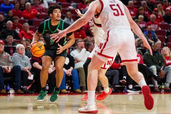 Nov 29, 2025; Lincoln, Nebraska, USA; South Carolina Upstate Spartans guard Mason Bendinger (9) looks to the hoop against Nebraska Cornhuskers forward Braden Frager (5) and forward Rienk Mast (51) during the second half at Pinnacle Bank Arena. Mandatory Credit: Dylan Widger-Imagn Images