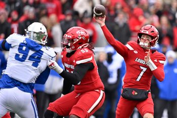 Nov 29, 2025; Louisville, Kentucky, USA;  Louisville Cardinals quarterback Miller Moss (7) attempts to pass against the Kentucky Wildcats during the first half at L&N Federal Credit Union Stadium. Louisville defeated Kentucky 41-0. Mandatory Credit: Jamie Rhodes-Imagn Images
