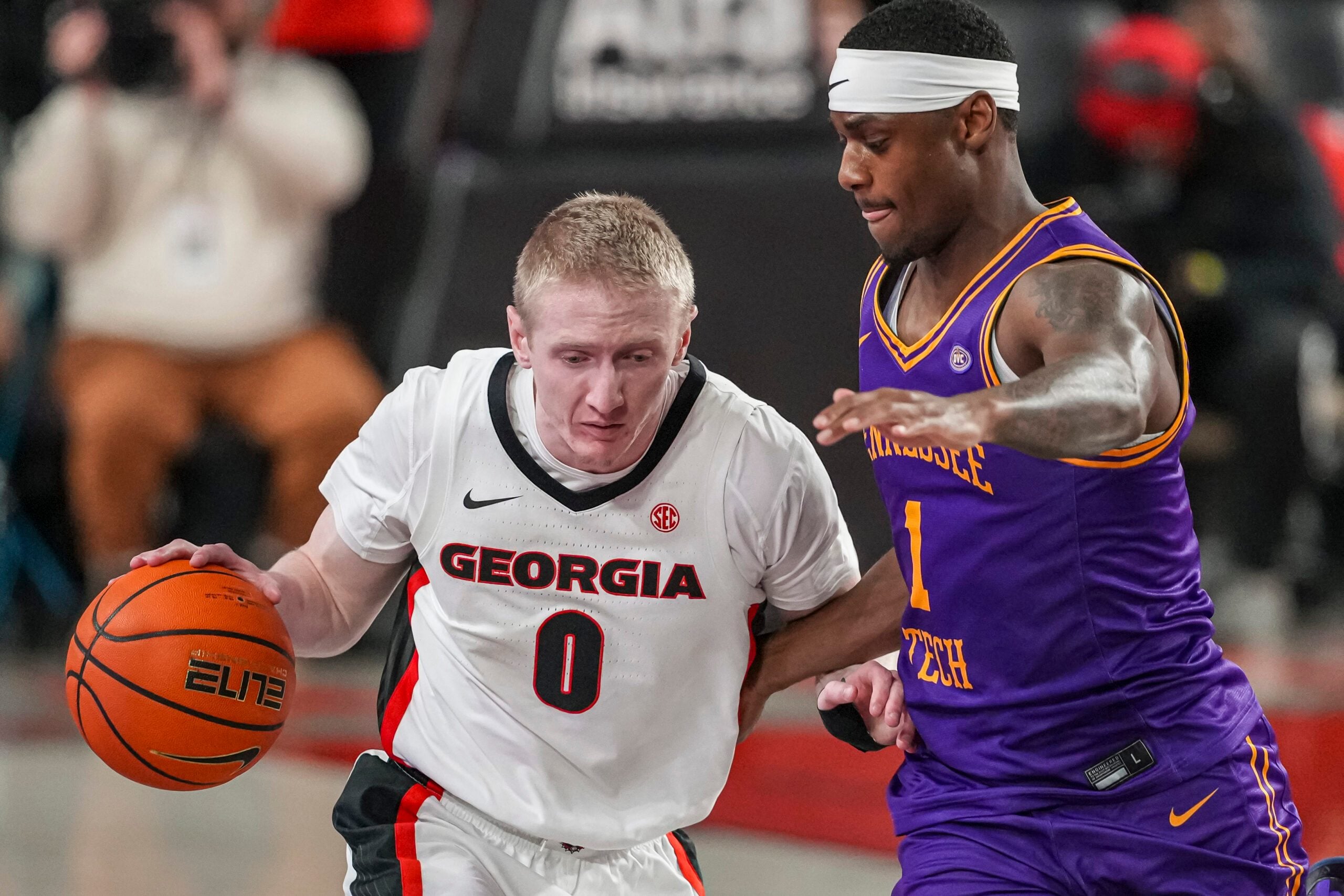 Nov 29, 2025; Athens, Georgia, USA; Georgia Bulldogs guard Blue Cain (0) dribbles against Tennessee Tech Golden Eagles guard Mekhi Cameron (1) during the second half at Stegeman Coliseum. Mandatory Credit: Dale Zanine-Imagn Images
