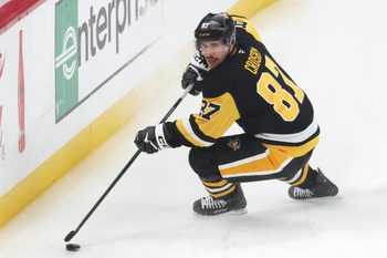 Nov 29, 2025; Pittsburgh, Pennsylvania, USA;  Pittsburgh Penguins center Sidney Crosby (87) handles the puck against the Toronto Maple Leafs during the third period at PPG Paints Arena. Mandatory Credit: Charles LeClaire-Imagn Images
