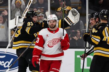 Nov 29, 2025; Boston, Massachusetts, USA; Detroit Red Wings right wing Alex Debrincat (93) skates away after being stopped on Detroit’s last shootout attempt by Boston Bruins goaltender Jeremy Swayman (1) who celebrates with center Fraser Minten (93) at TD Garden. Mandatory Credit: Winslow Townson-Imagn Images