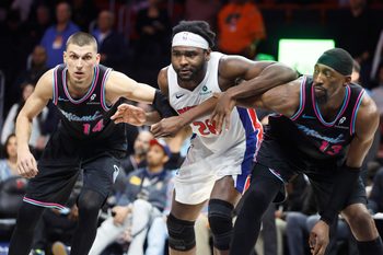 Nov 29, 2025; Miami, Florida, USA; Miami Heat guard Tyler Herro (14) and center Bam Adebayo (13) vie for position against Detroit Pistons forward Isaiah Stewart (28) during the second half at Kaseya Center. Mandatory Credit: Rhona Wise-Imagn Images