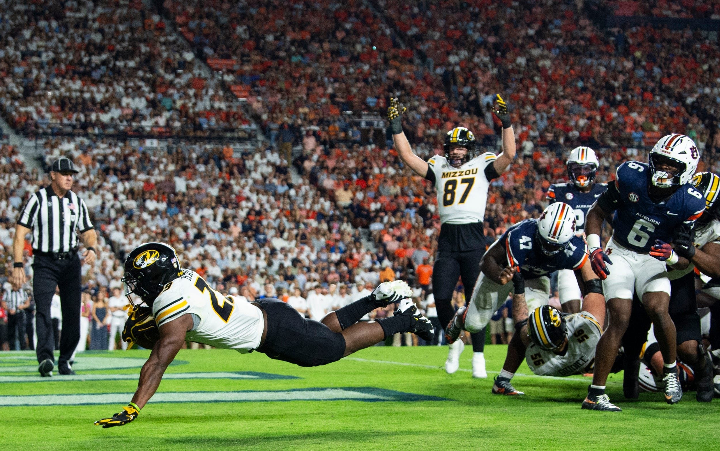 Missouri Tigers running back Ahmad Hardy (29) dives into the end zone for a touchdown as Auburn Tigers take on Missouri Tigers at Jordan-Hare Stadium in Auburn, Ala. on Saturday, Oct. 18, 2025. Missouri Tigers lead Auburn Tigers 10-7 at halftime.