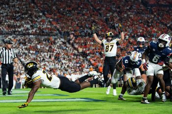 Missouri Tigers running back Ahmad Hardy (29) dives into the end zone for a touchdown as Auburn Tigers take on Missouri Tigers at Jordan-Hare Stadium in Auburn, Ala. on Saturday, Oct. 18, 2025. Missouri Tigers lead Auburn Tigers 10-7 at halftime.