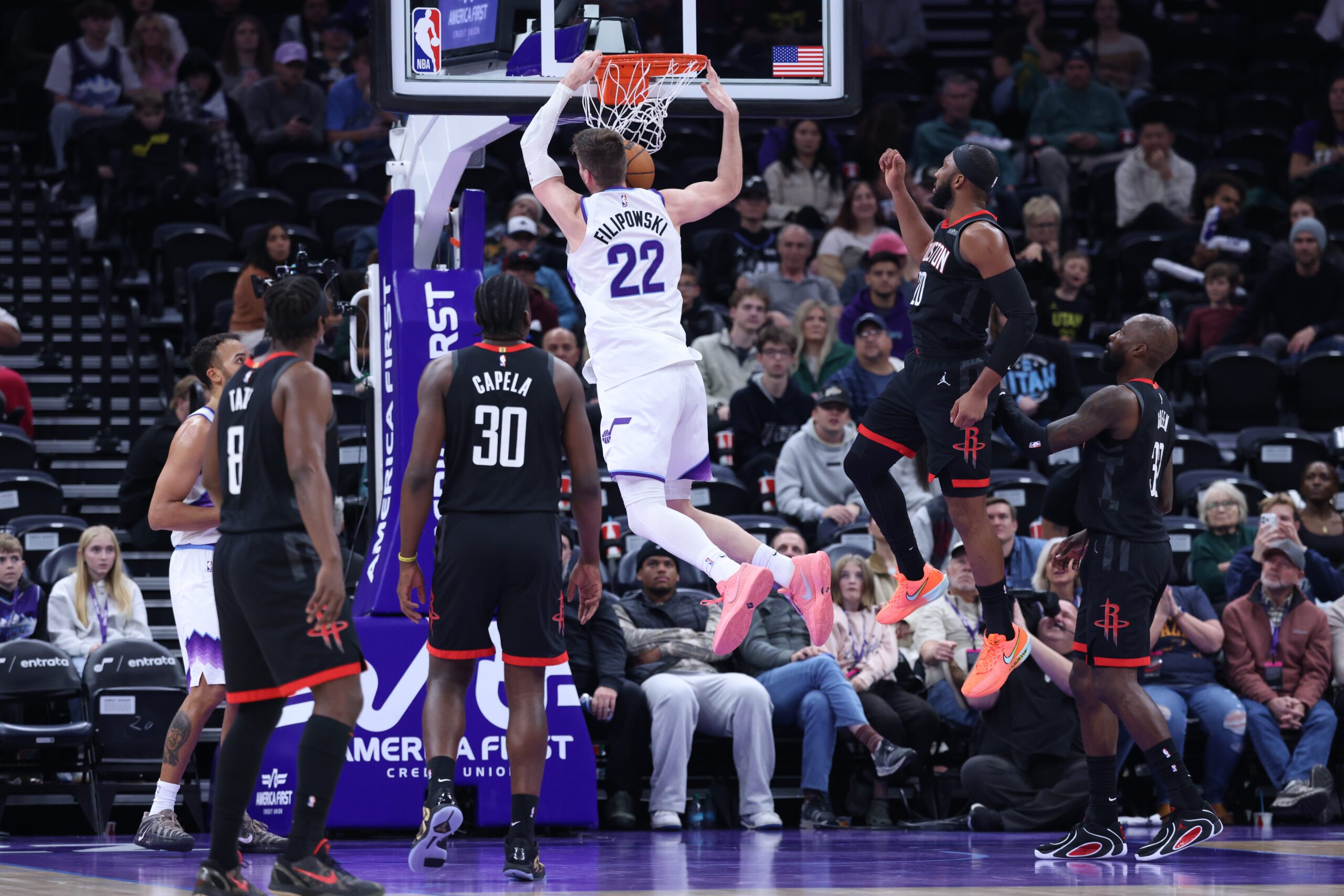 Nov 30, 2025; Salt Lake City, Utah, USA; Utah Jazz forward Kyle Filipowski (22) dunks against the Houston Rockets during the second half at Delta Center. Mandatory Credit: Rob Gray-Imagn Images