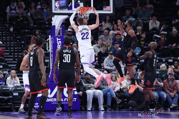 Nov 30, 2025; Salt Lake City, Utah, USA; Utah Jazz forward Kyle Filipowski (22) dunks against the Houston Rockets during the second half at Delta Center. Mandatory Credit: Rob Gray-Imagn Images