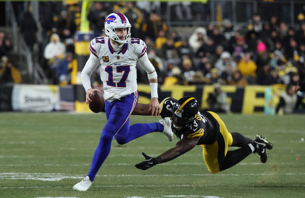 Nov 30, 2025; Pittsburgh, Pennsylvania, USA; Buffalo Bills quarterback Josh Allen (17) looks to pass as Pittsburgh Steelers defensive end Esezi Otomewo (93) attempts to tackle during the second quarter at Acrisure Stadium. Mandatory Credit: Charles LeClaire-Imagn Images