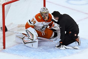 Nov 30, 2025; Chicago, Illinois, USA;  Anaheim Ducks goaltender Petr Mrazek (34) talks with a team member after being injured during the third period against the  Chicago Blackhawks at United Center. Mandatory Credit: Matt Marton-Imagn Images