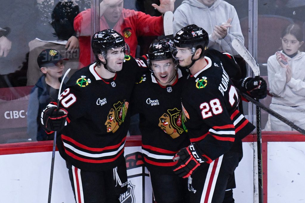 Nov 30, 2025; Chicago, Illinois, USA; Chicago Blackhawks center Connor Bedard (98) celebrates with center Ryan Greene (20) and left wing Andre Burakovsky (28) after he scores a goal against the Anaheim Ducks during the third period at United Center. Mandatory Credit: Matt Marton-Imagn Images