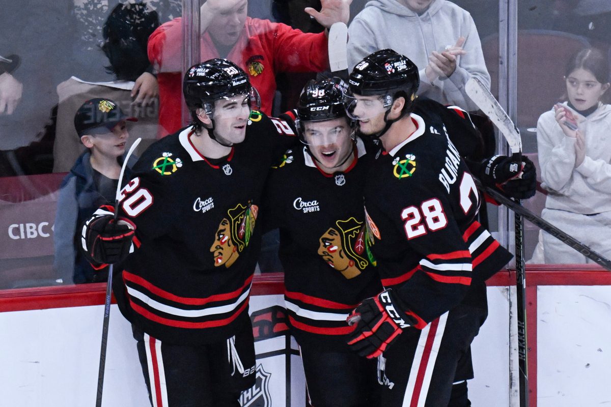 Nov 30, 2025; Chicago, Illinois, USA; Chicago Blackhawks center Connor Bedard (98) celebrates with center Ryan Greene (20) and left wing Andre Burakovsky (28) after he scores a goal against the Anaheim Ducks during the third period at United Center. Mandatory Credit: Matt Marton-Imagn Images