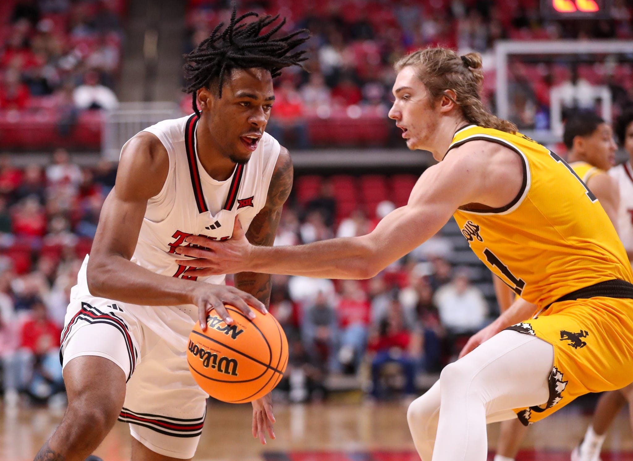 Texas Tech's JT Toppin handles the ball against Wyoming during a non-conference men's basketball game, Sunday, Nov. 30, 2025, at United Supermarkets Arena.